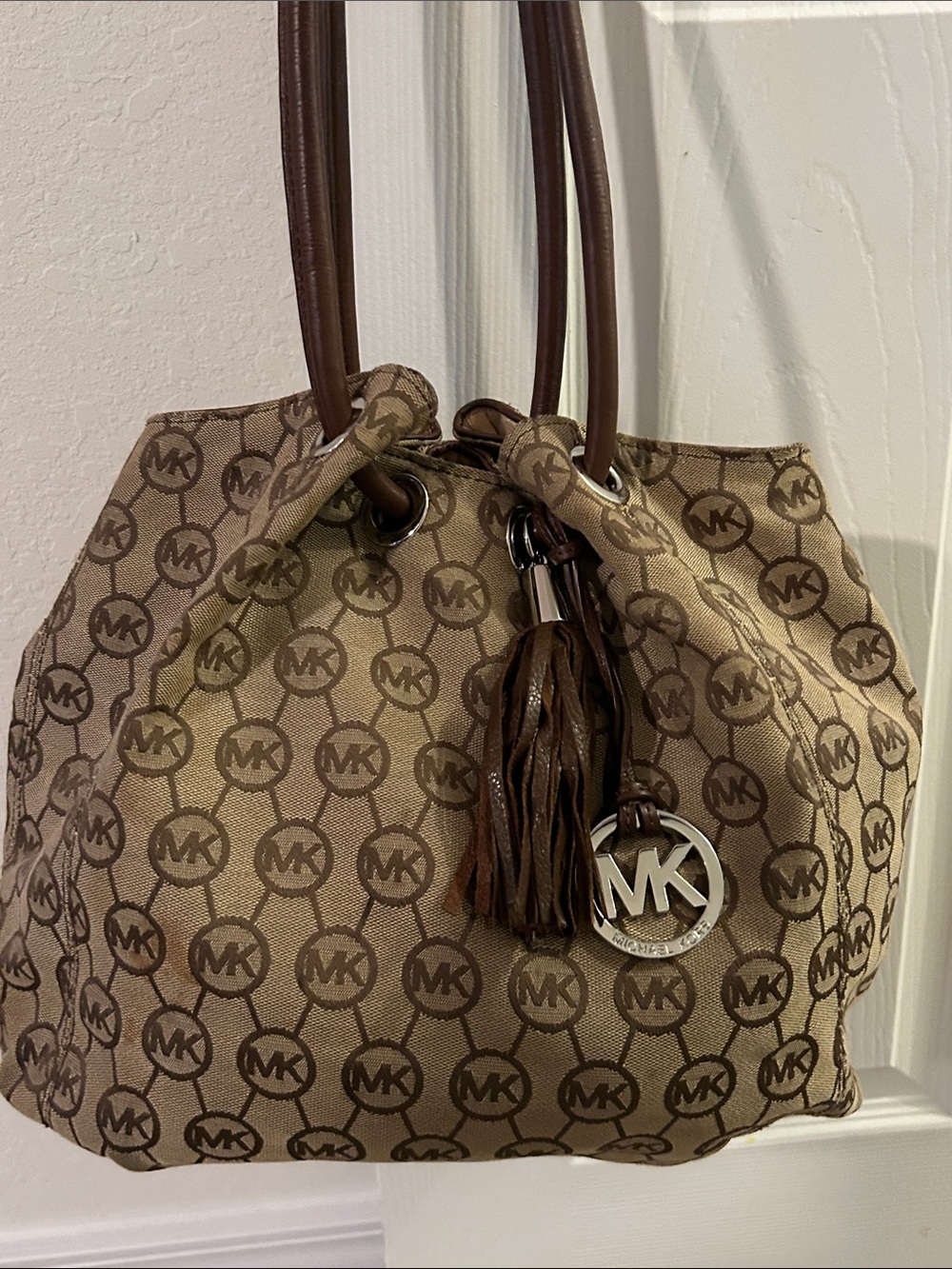 Michael Kors Tan and Brown Monogram Drawstring Shoulder Bag